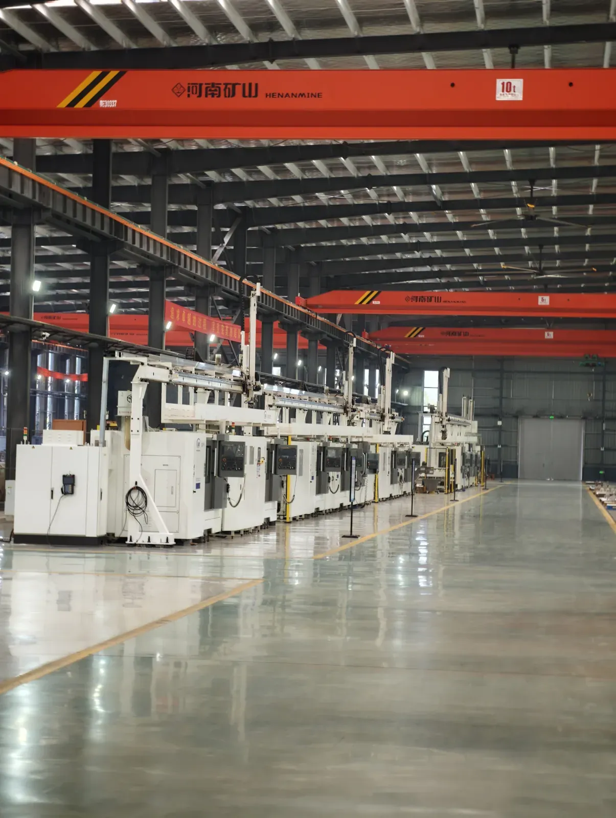 CNC lathe line with overhead crane in the workshop